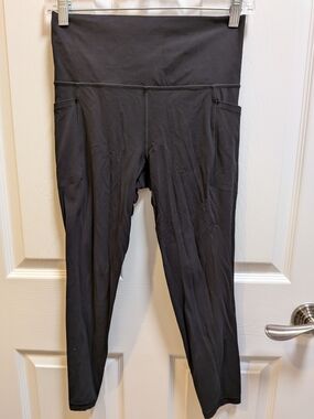 Athleta Black High-Rise Leggings with Side Pockets Salutation Stash 7/8 Size S